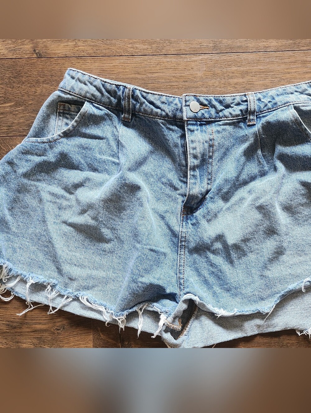 High-Rise Light Blue Denim Cutoff Shorts with Frayed Hem